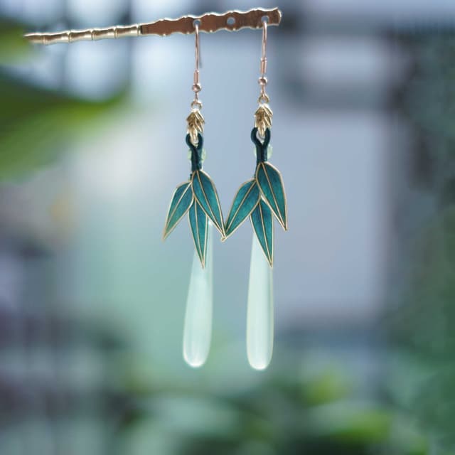 Jade Bamboo Song — Velvet Leaf Earrings — the piece resting in soft light