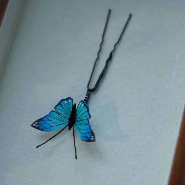 Butterfly Dream — Hand-Painted Velvet Pin — the piece resting in soft light