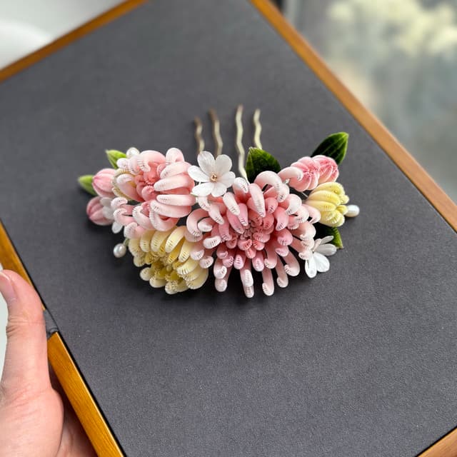 Abundance — Multi-Bloom Chrysanthemum Hairpin — the piece resting in soft light