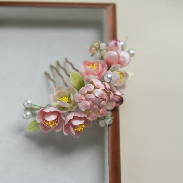 Spring Splendour — Pink Chrysanthemum Comb — the piece resting in soft light