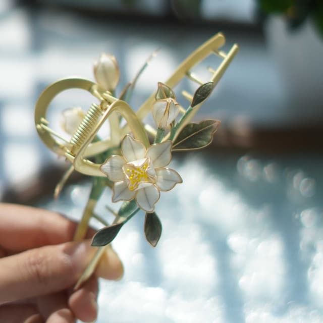 White Gardenia — Velvet Flower Claw Clip — the piece resting in soft light