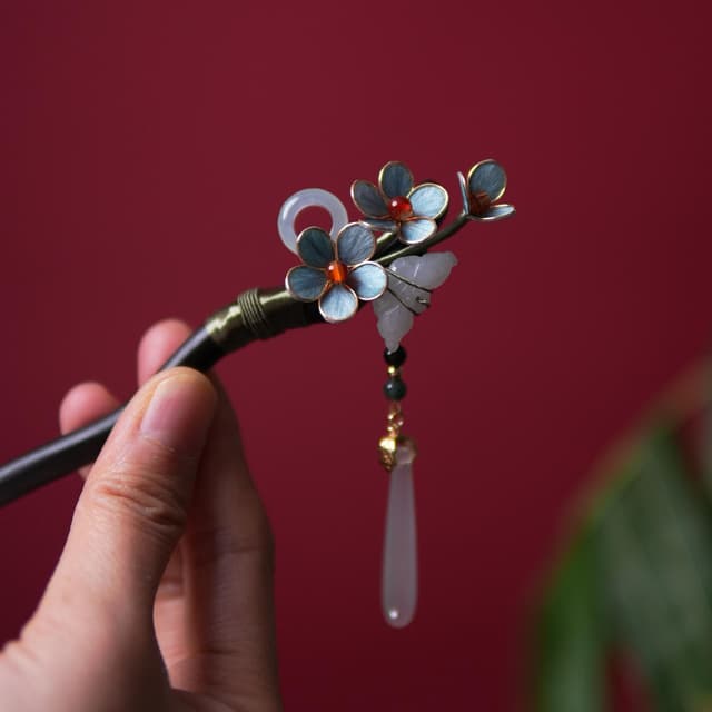 Ice Pure — White Chrysanthemum Hairpin — the piece resting in soft light