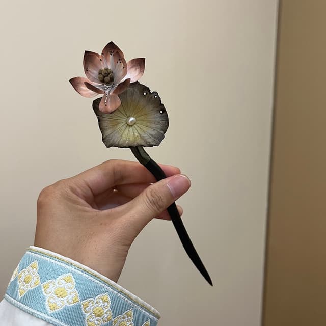 Zen Lotus — Ebony Velvet Flower Hairpin — the piece resting in soft light