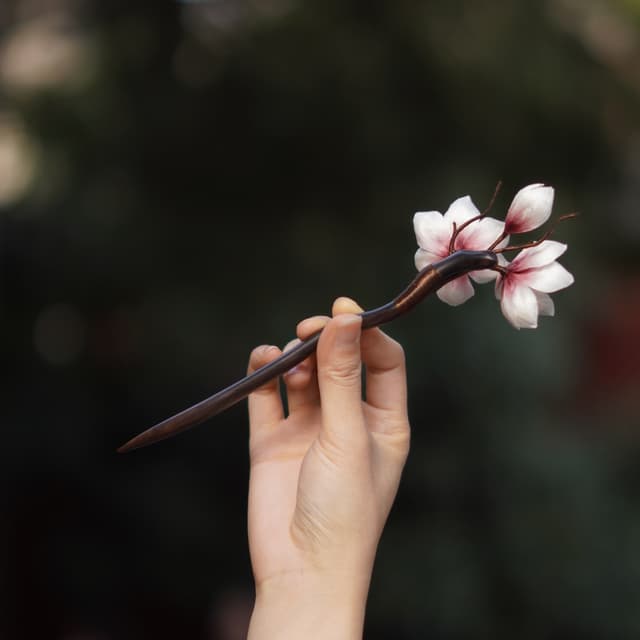 Magnolia — Velvet Flower Hairpin — the piece resting in soft light