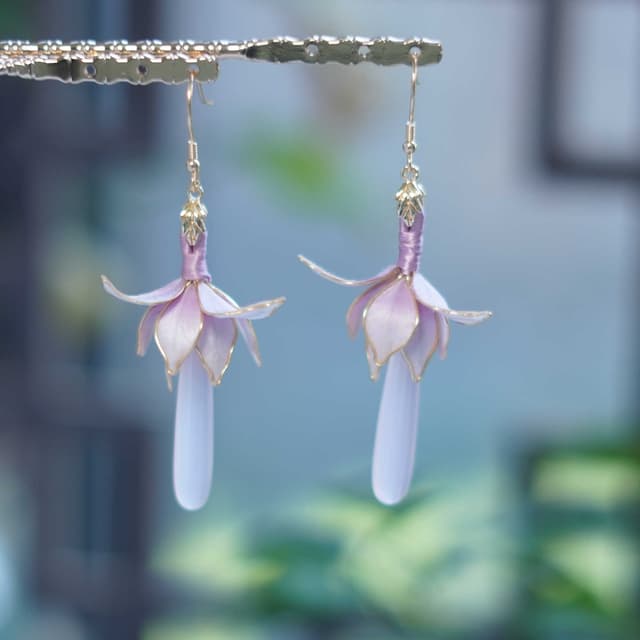 Magnolia — Velvet Flower Earrings — the piece resting in soft light