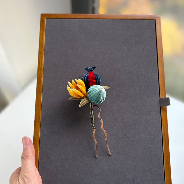 Three Plenties — Fine Velvet Hairpin — the piece resting in soft light